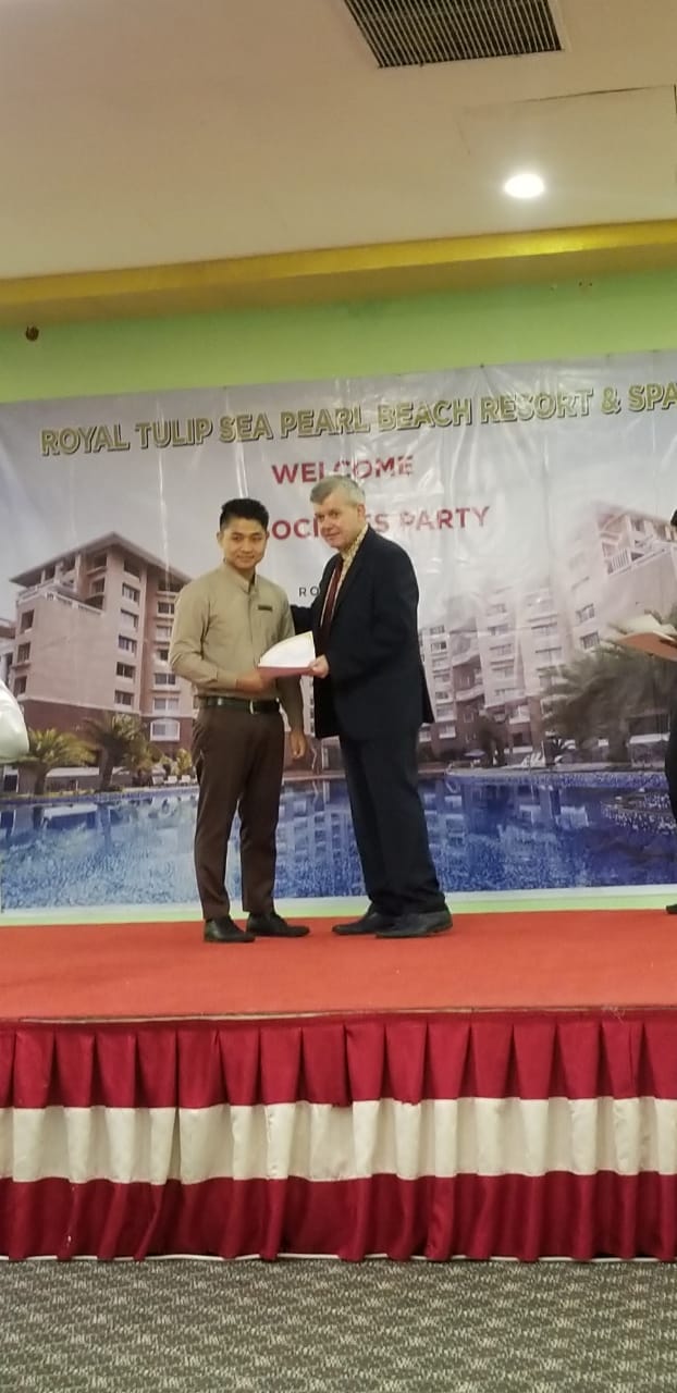 Employee of the month ceremony on stage at Royal Tulip Sea Pearl Beach Resort & Spa, Cox's Bazar