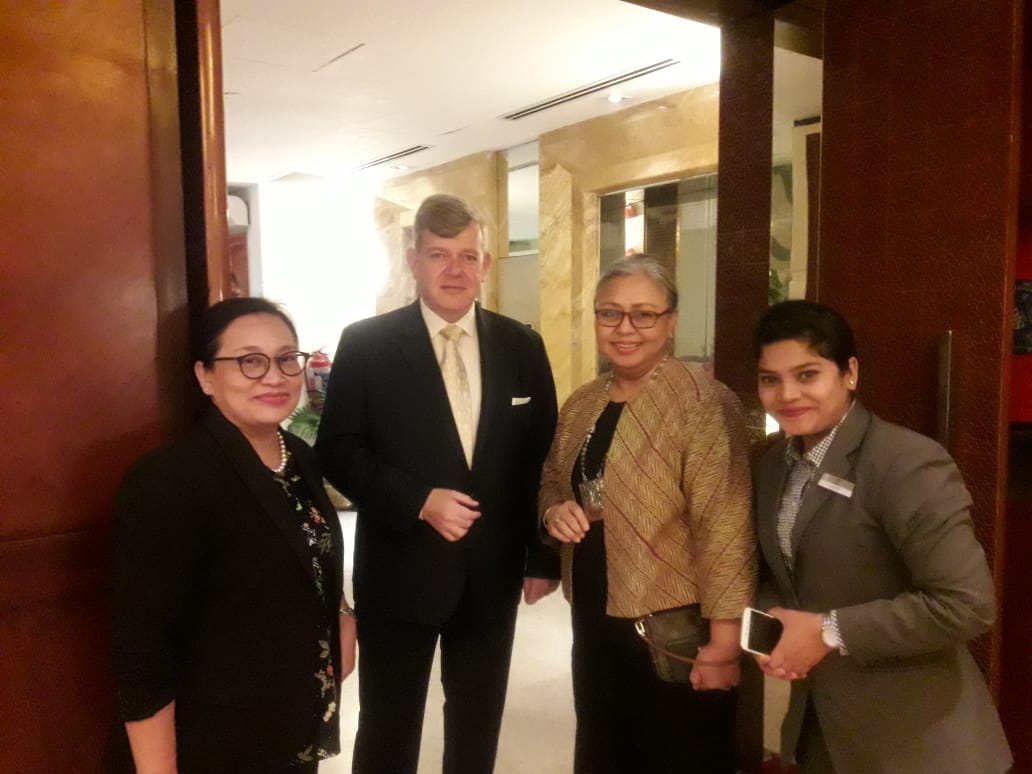 Hotel management team meeting in lobby