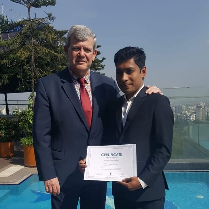 Stephane Meunier presenting a language course certificate at Six Seasons Hotel Dhaka